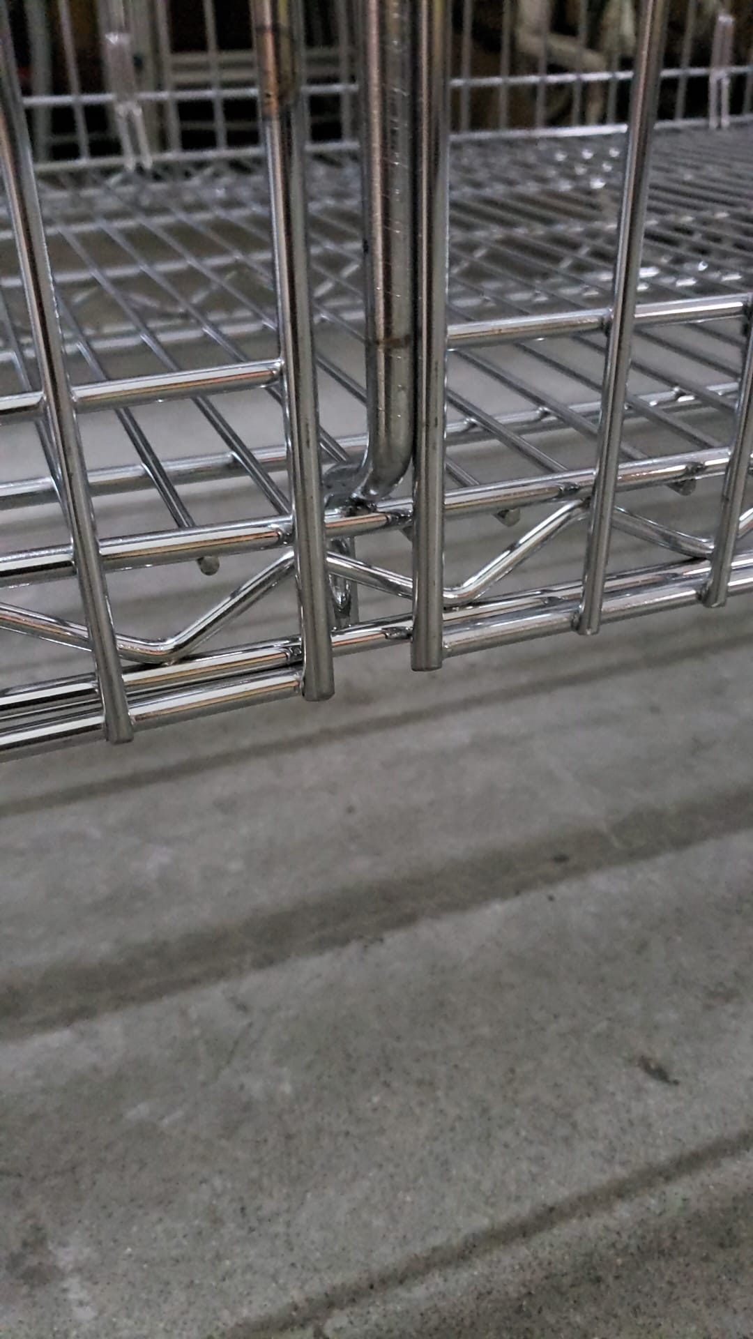Chrome wire storage shelving base frame and shelf edge detail in Singapore warehouse