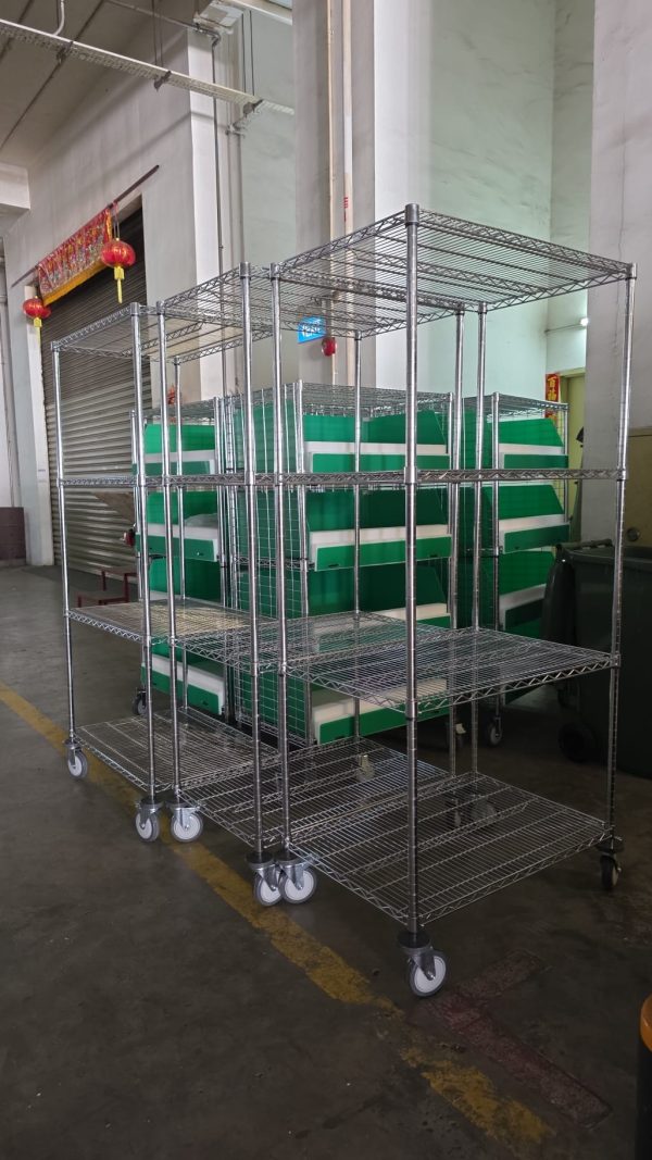 Chrome Wire Storage Shelving Singapore Warehouse Chrome wire storage shelving units holding green plastic bins in Singapore warehouse
