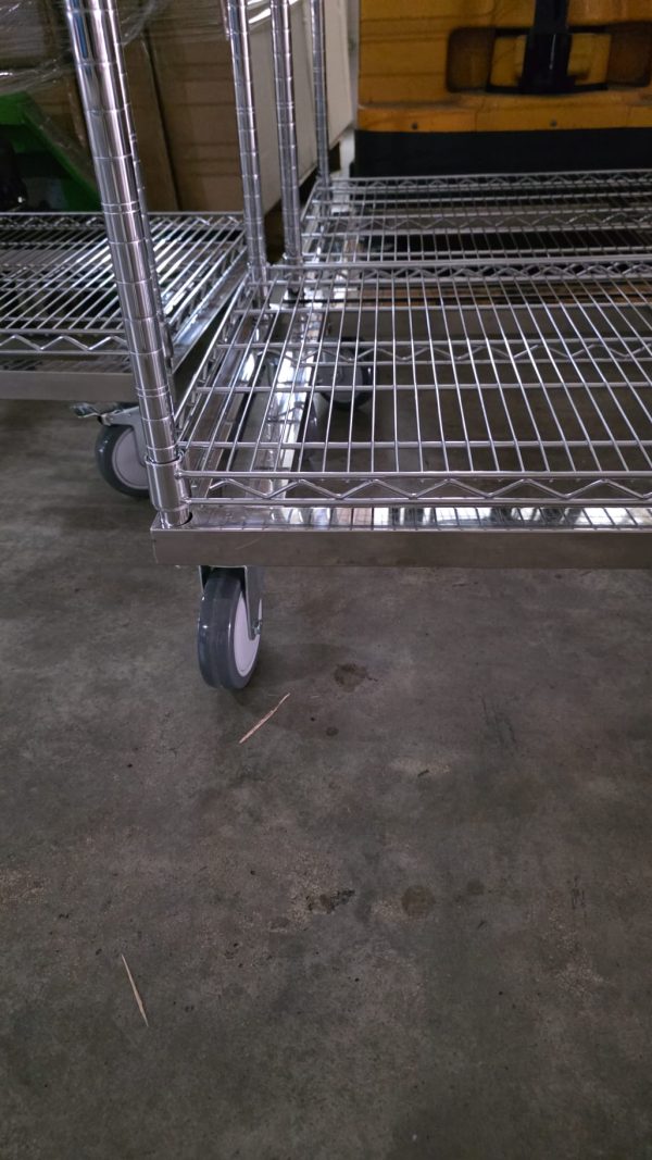 Chrome wire storage trolley caster wheel and base detail for Singapore industrial use