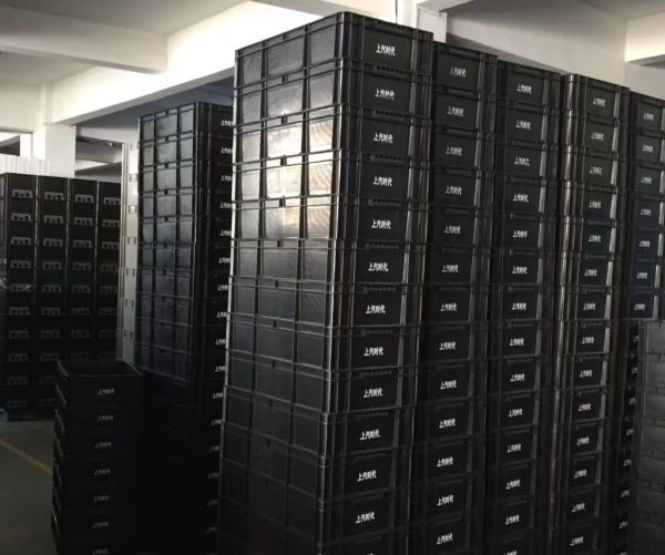 Conductive ESD storage box Singapore stacked in a warehouse for safe handling of electronics