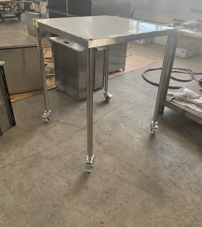 Mobile stainless steel table with square top on four lockable castors, fabricated in Singapore by Phil Industries