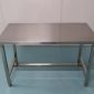 Stainless steel workbench with square-tube legs and H-frame bracing, fabricated in Singapore by Phil Industries